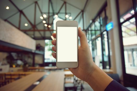 Close up of women's hands holding cell telephone blank copy space screen. smart phone with technology concept.