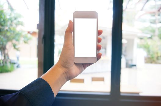 Close up of women's hands holding cell telephone blank copy space screen. smart phone with technology concept.