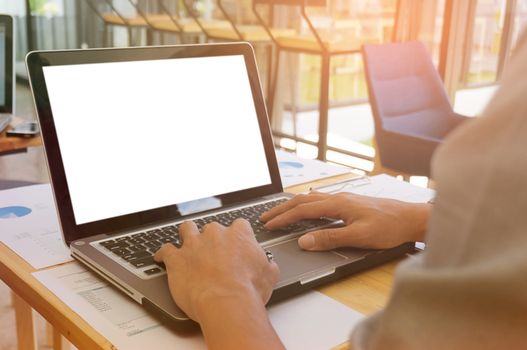 View of Details of business man hands typing on keyboard with blank screen.