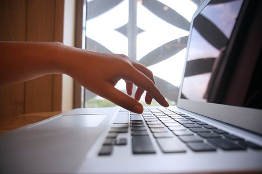 The Casual business woman works Hand typing on laptop keyboard