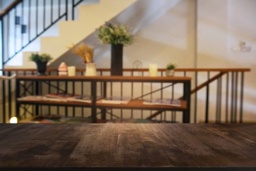 Empty wooden table in front of abstract blurred background of coffee shop . can be used for display Mock up  of product.