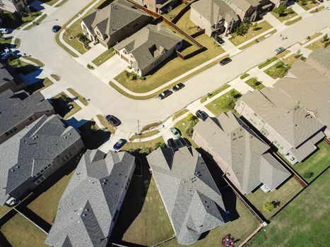 Aerial view new development community with row of detached single-family house and garden. Flyover residential area suburban Dallas, Texas, USA