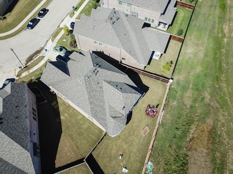 Aerial straight down view of brand new single-family houses with garden, wooden fence near Dallas, Texas, USA