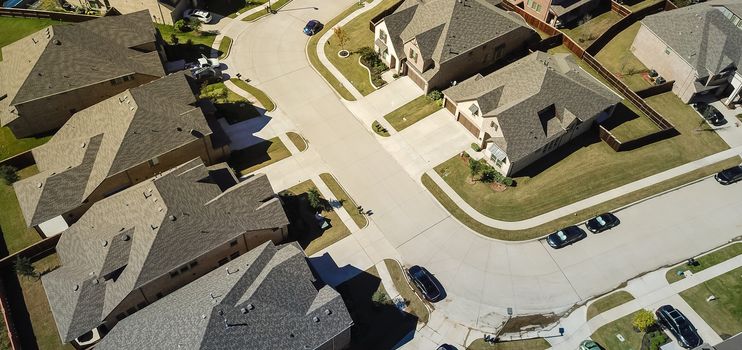 Panorama aerial view new development community with row of detached single-family house and garden. Flyover residential area suburban Dallas, Texas, USA