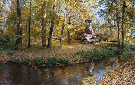 Uman, Ukraine - 10.13.2018. Beautiful autumn trees around the old alcove in Sofiyivka park, Ukraine