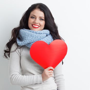 Woman holding paper heart shaped card . Valentine day concept . I'm looking waiting for partner ! Advertising people person relationship couple concept , white background