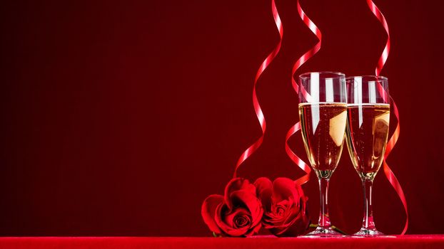Romantic Celebration Of Valentine's Day With Champagne Wine And red Roses , red background with copy space