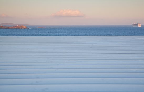 white wooden planks, sunset sky. sea