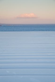 white wooden planks, sunset sky. sea