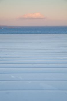 white wooden planks, sunset sky. sea