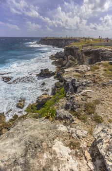 Seascape of rocky coastline with cliff overlooking the sea at Isla Mujeres in Mexico