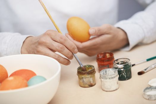 Woman preparing Easter eggs