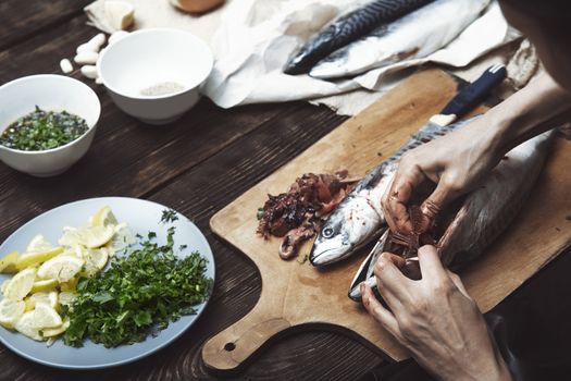 Woman preparing mackerel