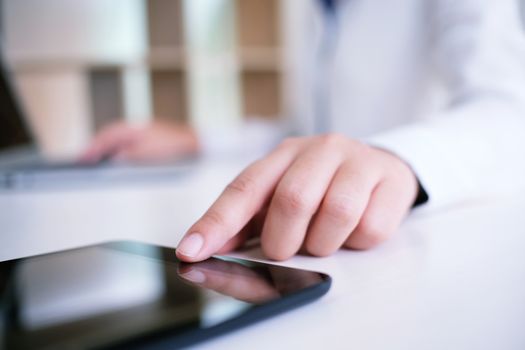 businesswoman using digital tablet in the office