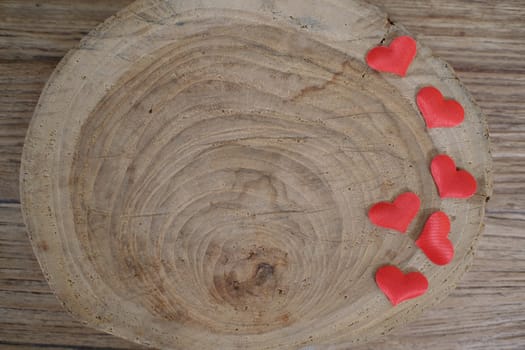 Love Valentines day background with red hearts. copy space on wooden table.