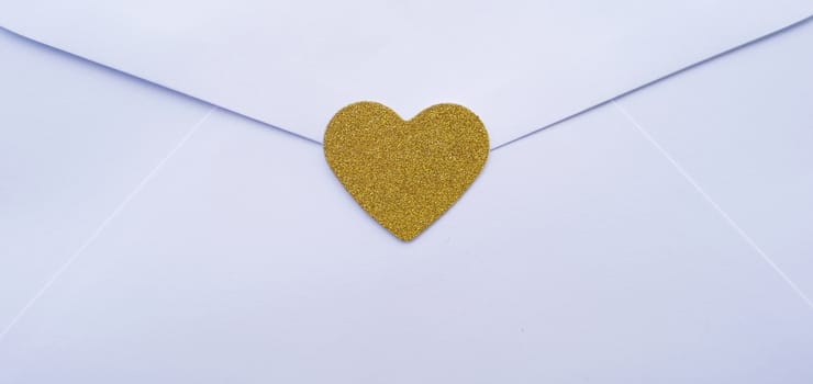 Valentine's day love letter envelope with hearts on wooden background. copy space