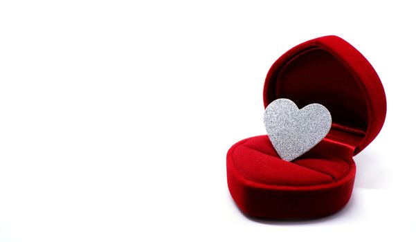  Silver glitter heart in wedding ring box. Valentines day present concept