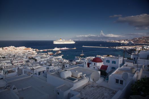 panoramic view of the Mykonos town harbor from the above hills on a sunny summer day, Mykonos, Cyclades, Greece