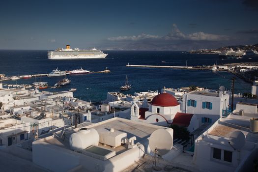 panoramic view of the Mykonos town harbor from the above hills on a sunny summer day, Mykonos, Cyclades, Greece