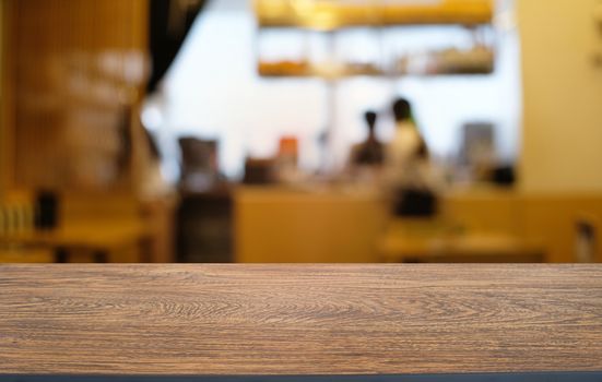 Empty wood table top and blur of night market background/selective focus .For montage product display