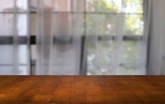 Empty dark wooden table in front of abstract blurred bokeh background of restaurant . can be used for display or montage your products.Mock up for space