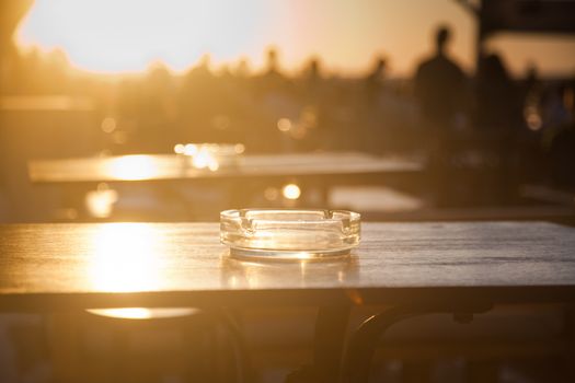 sunset bar by the beach - focus on table