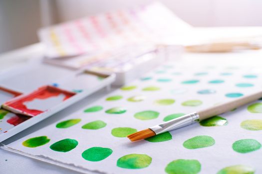 Watercolor paints and brushes workplace artist with artistic tools for mock up