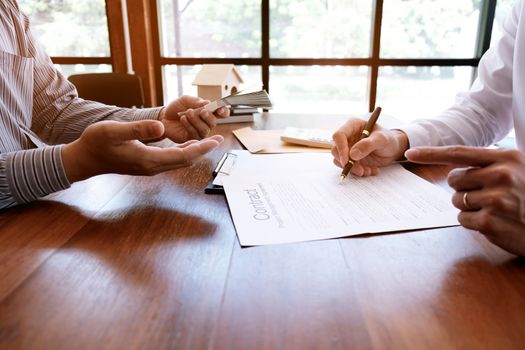 Business people signing contract making a deal with real estate agent Concept for consultant and home insurance concept