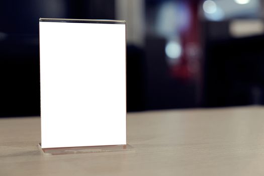 Menu frame standing on wood table in Bar restaurant cafe. space for text marketing promotion