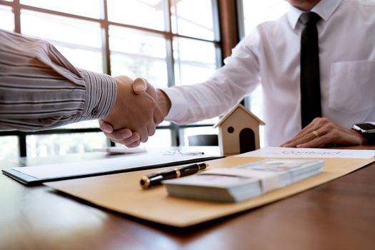 Business people signing contract making a deal with real estate agent Concept for consultant and home insurance concept