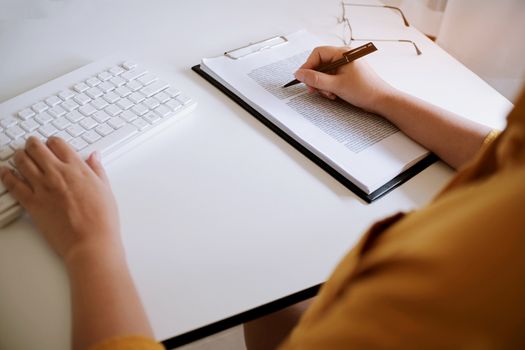 Business accounting women work with calculator and Laptop. Financial technology concept.