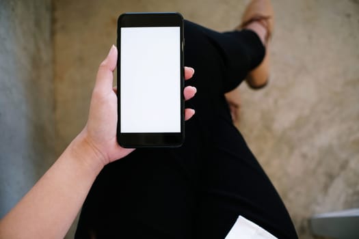 Close up of women's hands holding cell telephone blank copy space screen. smart phone with technology concept.