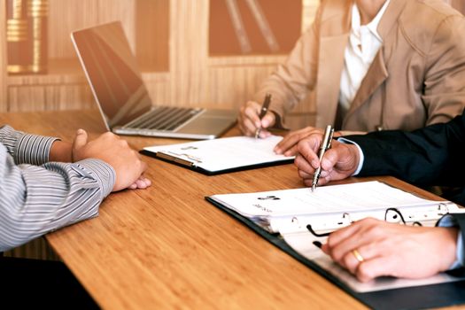 Examiner reading a resume during job interview at office Business and human resources concept.