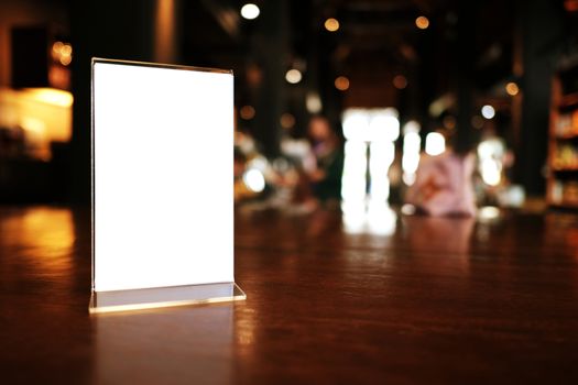 Menu frame standing on wood table in Bar restaurant cafe. space for text marketing promotion