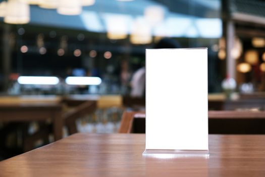 Menu frame standing on wood table in Bar restaurant cafe. space for text marketing promotion