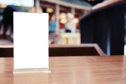 Menu frame standing on wood table in Bar restaurant cafe. space for text marketing promotion