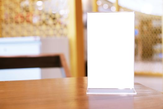 Menu frame standing on wood table in Bar restaurant cafe. space for text marketing promotion