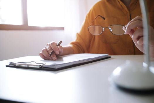 Business accounting women work with calculator and Laptop. Financial technology concept.