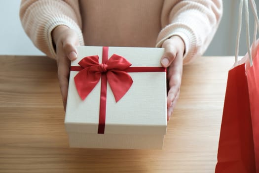 Valentine present. Gift box and red ribbon for romantic couple