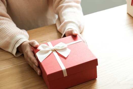 Valentine present. Gift box and red ribbon for romantic couple