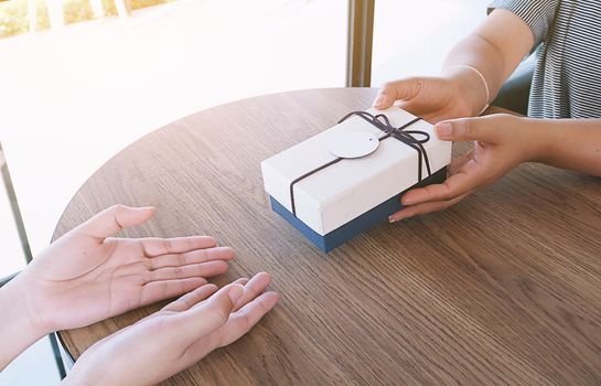 Valentine present. Gift box and red ribbon for romantic couple