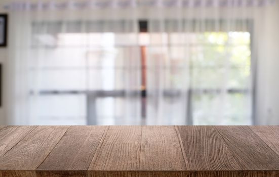 Empty dark wooden table in front of abstract blurred bokeh background of restaurant . can be used for display or montage your products.Mock up for space