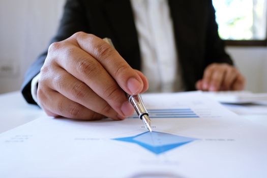 Accountant Working man uses calculator with Spreadsheet document, information financial concept