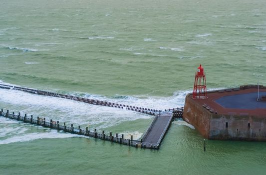 the pier jetty with lighthouse and wild sea, sea landscape, Vlissingen, zeeland, the Netherlands