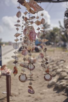 Stand full of dreamcatchers made with shells in a small street of Isla Mujeres in Mexico.