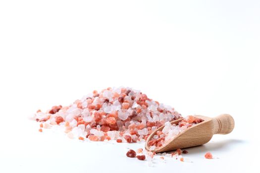 Himalaya Salt Pile with Wood Spoon Isolated On White Background