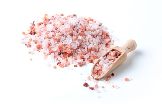 Himalaya Salt Pile With Wood Spice Spoon Isolated On White Background