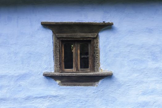 Carved Old Wood Window on blue house