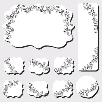 Different shape cards with black floral design on white background. 