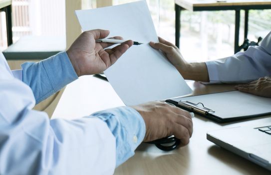 close up of patient and doctor taking notes or Professional medical doctor in white uniform gown coat interview.